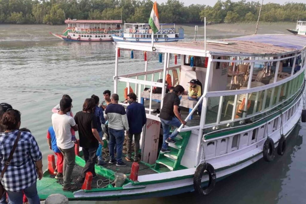 Tourists boarding a boat for Sundarban safari.