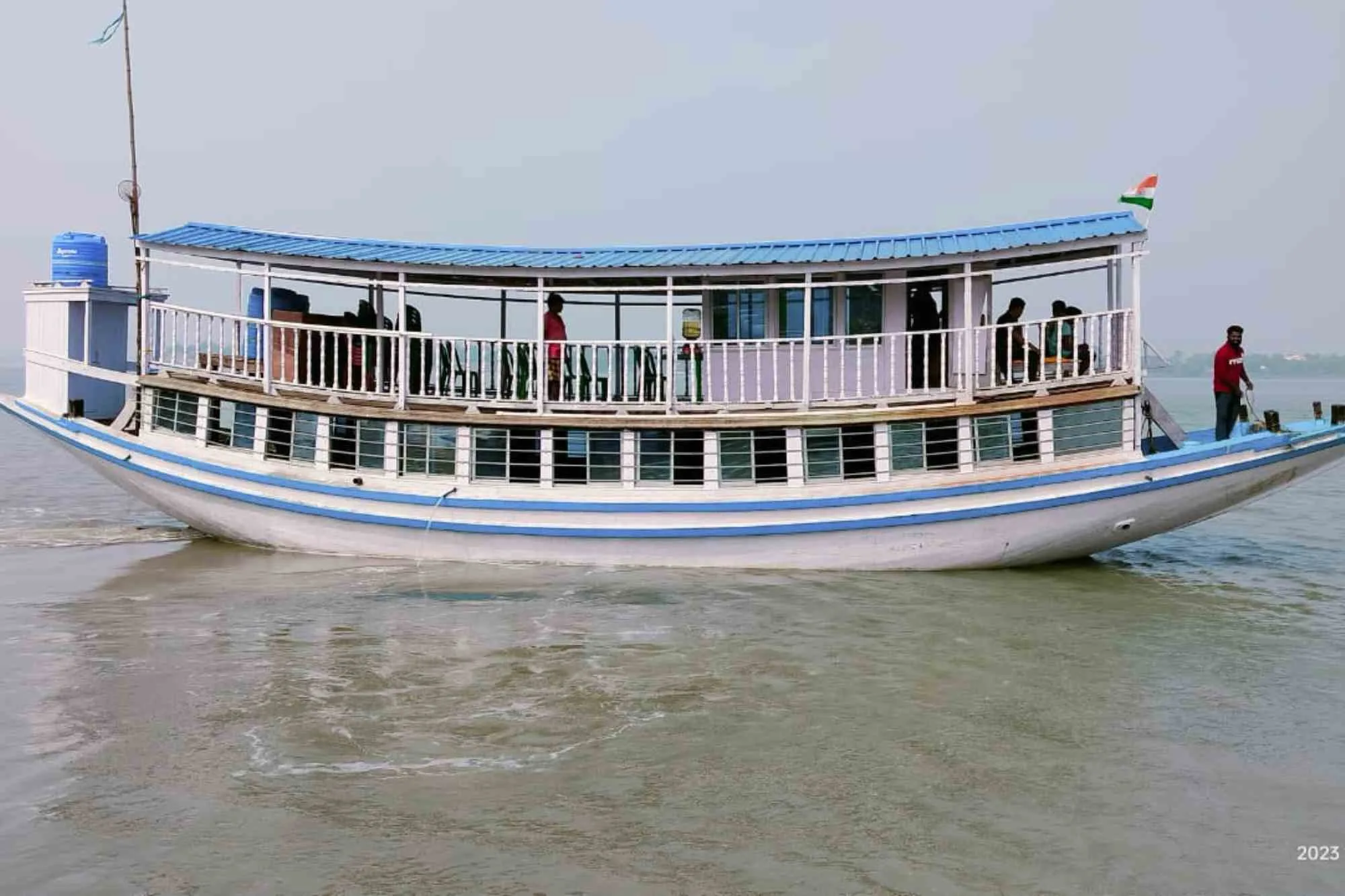 Boat rafting on Sundarban river with another boat.