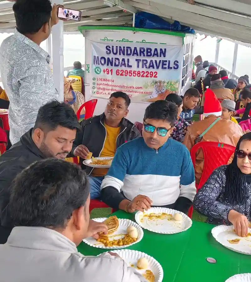 Tourists enjoying breakfast on boat during Sundarban tour by Sundarban Mondal Travels
